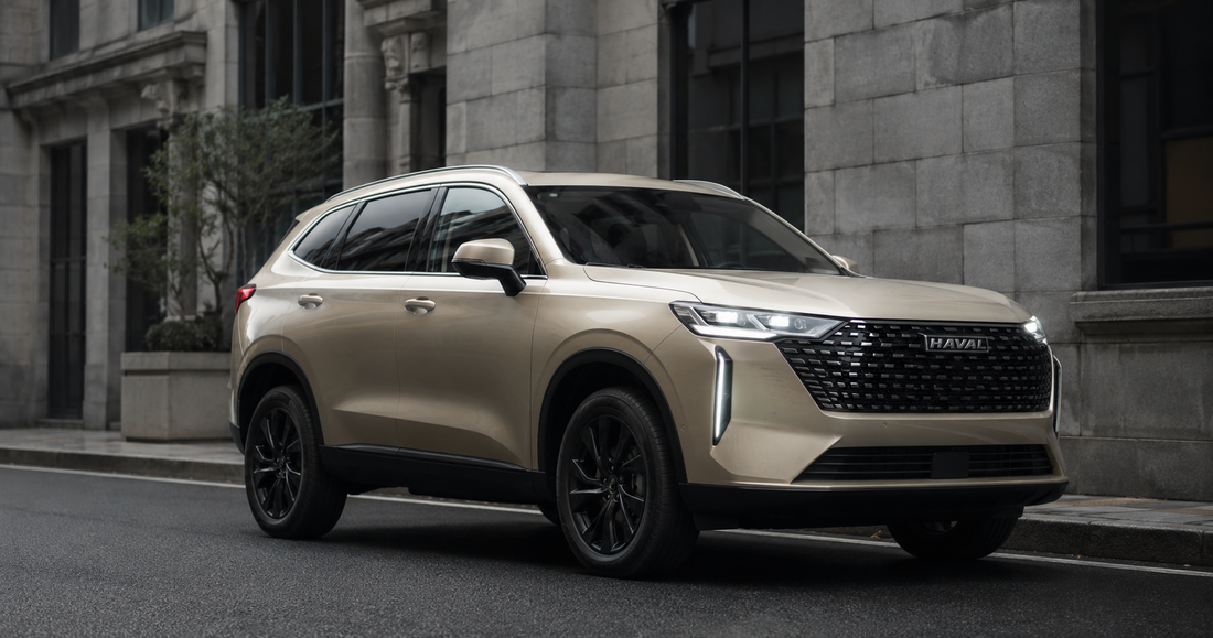 Champagne Haval Jolion compact SUV parked on a city street, featured in Northly's wireless CarPlay and Android Auto guide for Chinese-brand cars sold in South Africa including Haval, Chery, Omoda, GWM, Geely and BYD