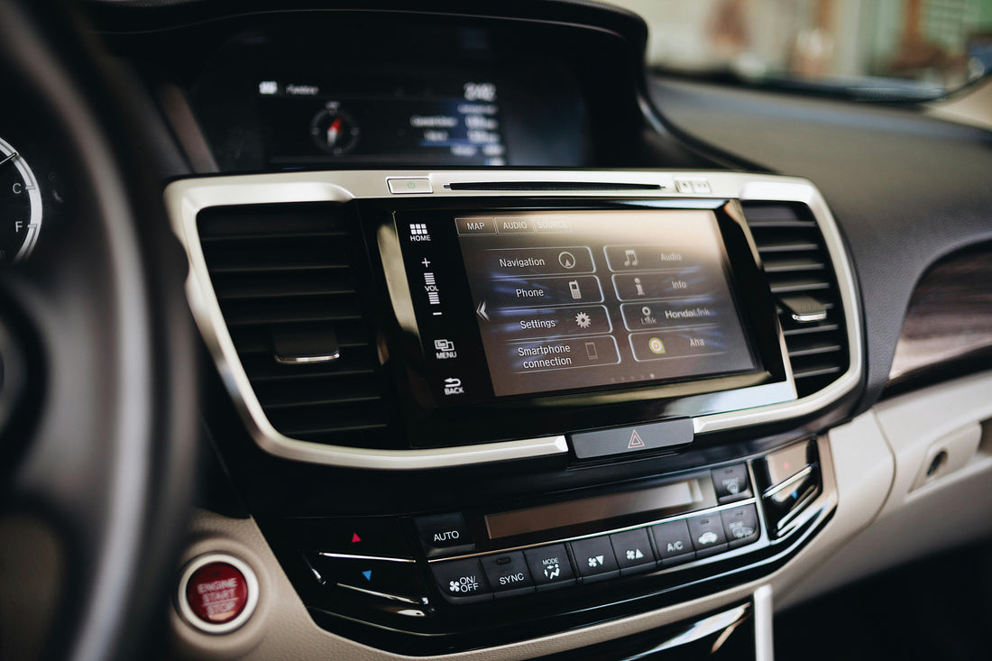 Modern car infotainment touchscreen showing navigation and smartphone projection, the kind of display a wireless CarPlay and Android Auto adapter feeds in South African cars