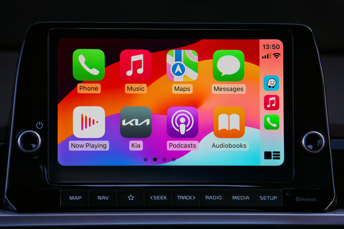 Car infotainment touchscreen showing a wireless CarPlay-style app grid on the dashboard of a modern Kia, featured in Northly's beginner guide to wireless CarPlay for South African drivers